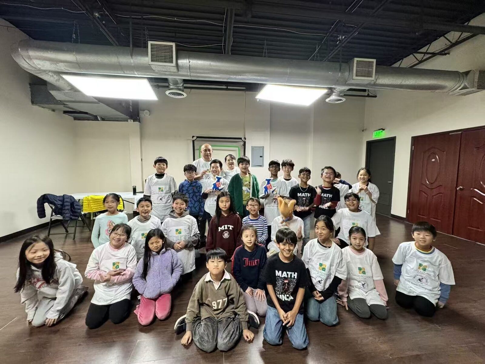 AAA students celebrating together after a team competition