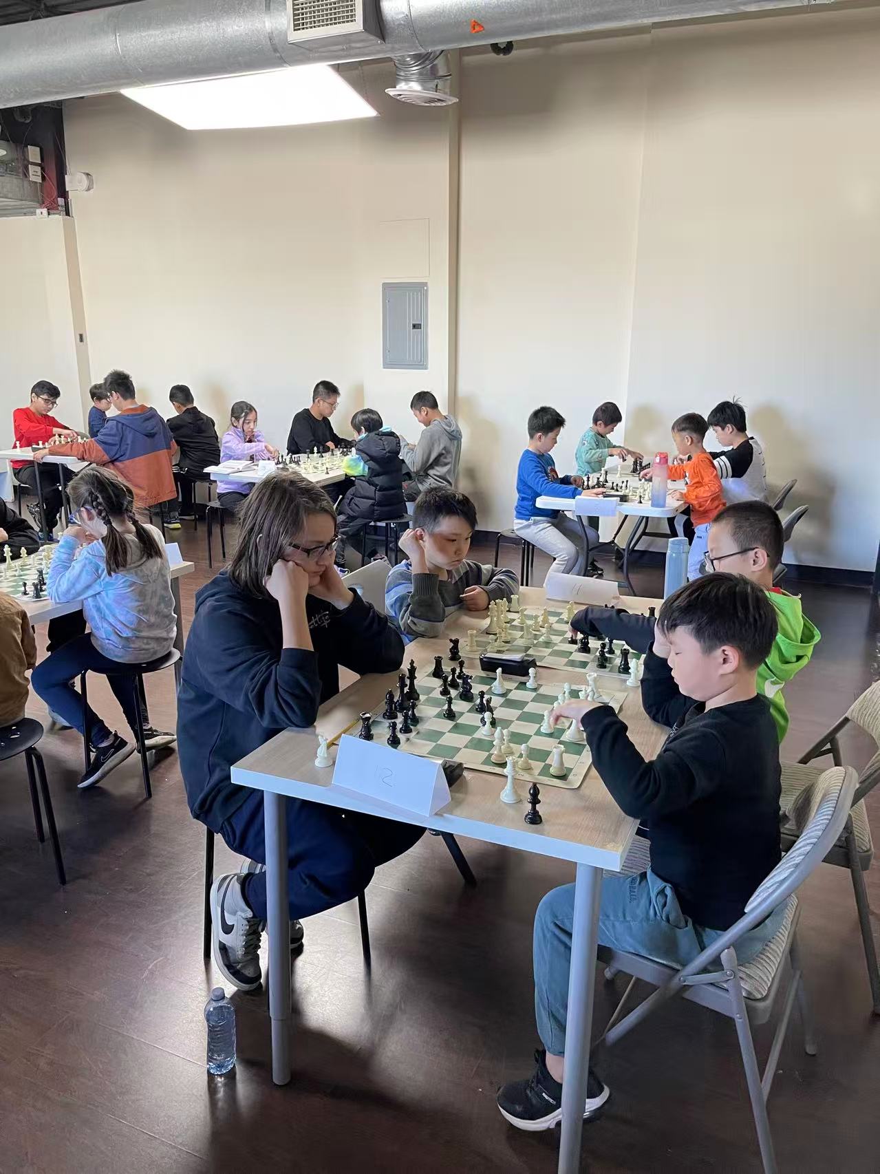 AAA summer campers playing chess together